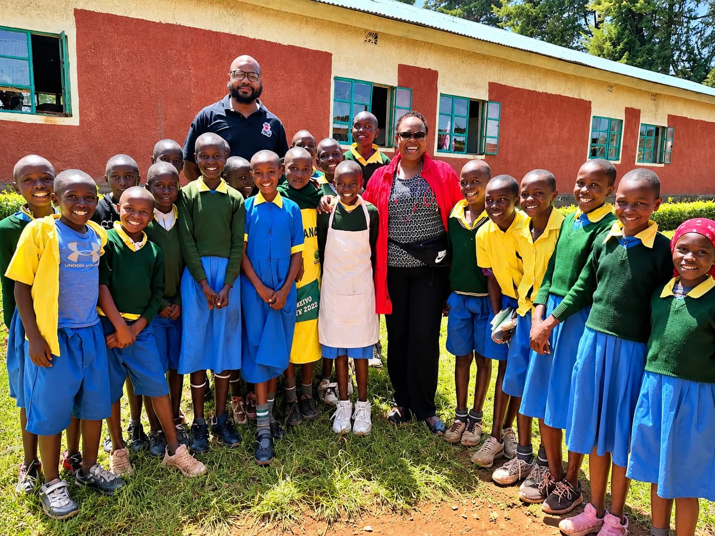 Prof. Rotich and a program partner with primary-school students in Kenya